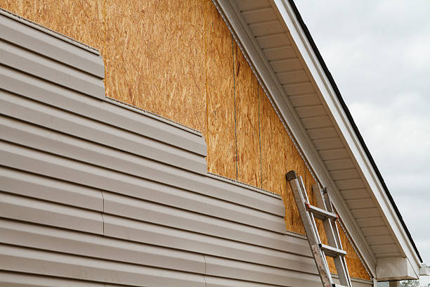 Professional Emergency Siding Repair technician working in Leasburg, NC